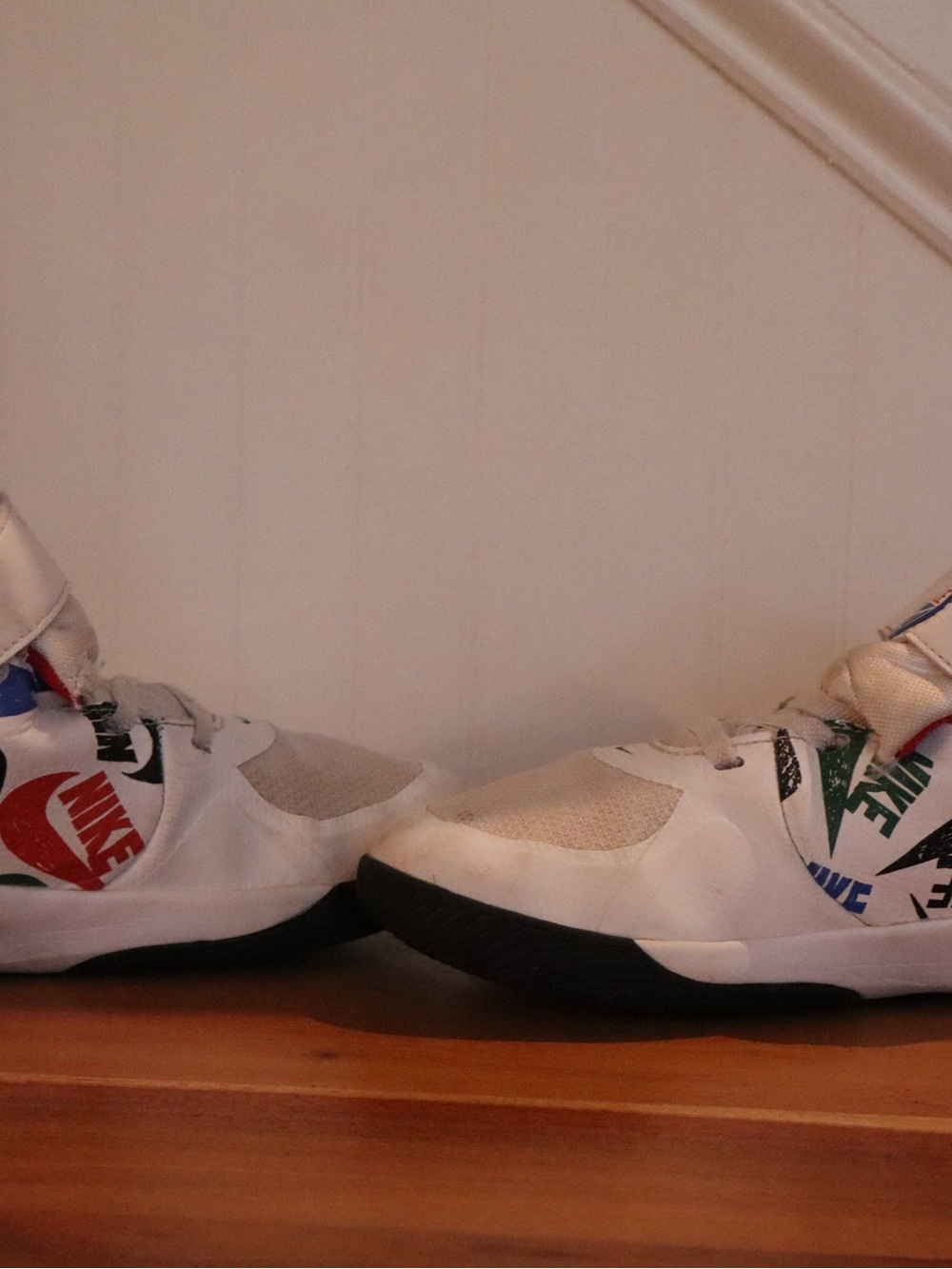 Nike Kids White Sneakers with Multicolor Logo Accents